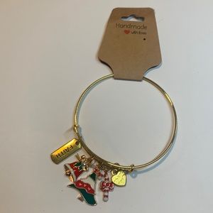 Handmade gold tone stainless steel bracelet with 5 charms.